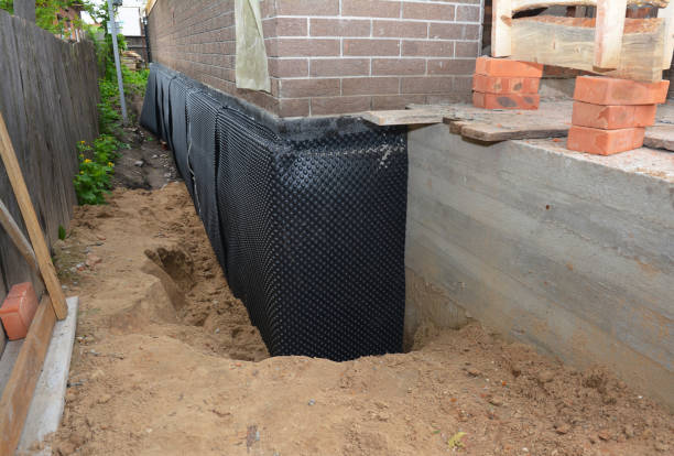 Happy homeowners after waterproofing job in Bel Alton